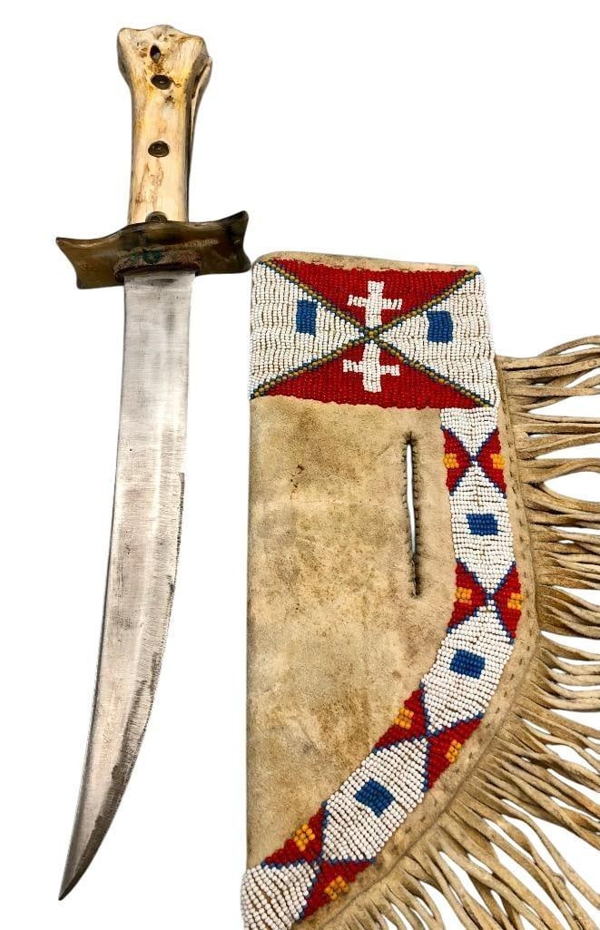 Handmade Bone Handle Knife With Beaded Sheath: Offered here for your consideration is a handmade bone handle knife with beaded sheath. The sheath is constructed of a sinew sewn brain tanned leather that was decorated with beads of r