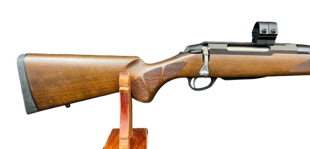 Tikka T3 Bolt Action Rifle In .300 Win Mag: For your bidding pleasure is a Tikka T3 bolt action rifle in .300 Win Mag. The furniture is dark wood with nice checkered designs and a factory recoil pad. This rifle comes with a detachable box magaz