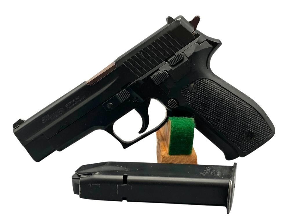 Sig Sauer Model P226 9mm Pistol: For your bidding pleasure is a Sig Sauer Model P226 9mm pistol. This West German made pistol has a matte black frame with polymer grips and a black stainless slide. Comes with a Sig Sauer magazine tha