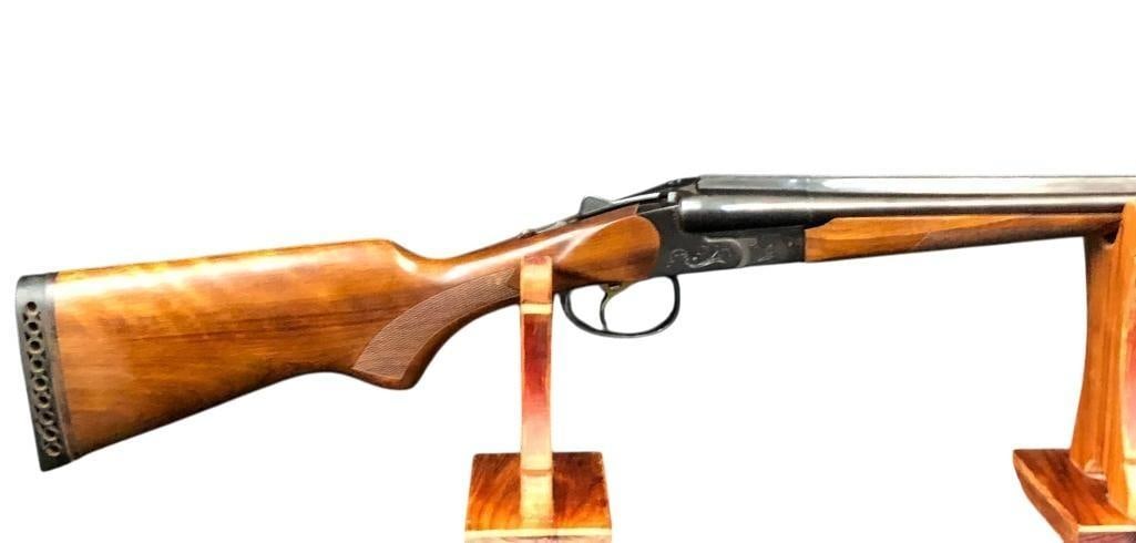 Baikal 410 Gauge SxS Shotgun: For your bidding pleasure is a Baikal (made in Russia) 410 gauge shotgun. This top break side by side shot gun has checkered wood forestock and stock with rubber recoil pad. The action is nicely engra
