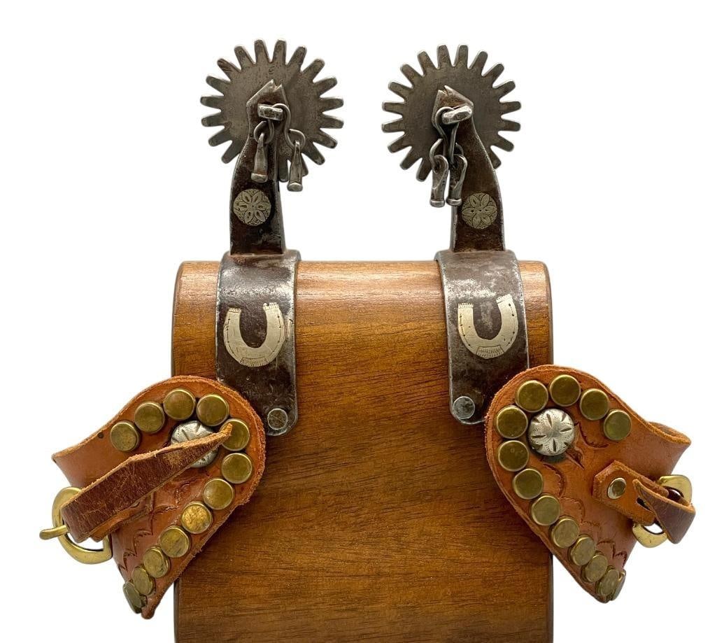 Handmade Horseshoe Themed Cowboy Spurs: Available here for your consideration are a pair of handmade horseshoe themed cowboy spurs. These spurs are double mounted with silver inlay floral and horseshoe decorations. They have large 20 point 