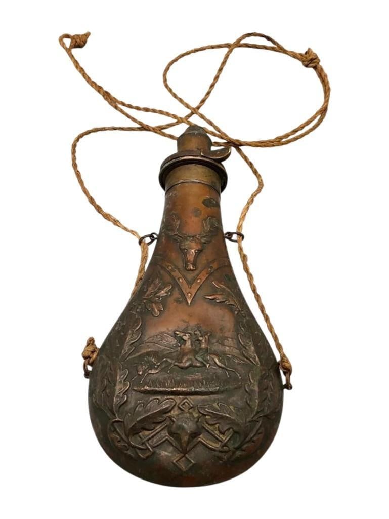 Antique Heavily Embossed Brass Powder Flask: Offered here for your consideration is an antique heavily embossed brass powder flask. Powder flasks were used for rifles, shotguns and pistols with the size usually an indicator of which weapon syste