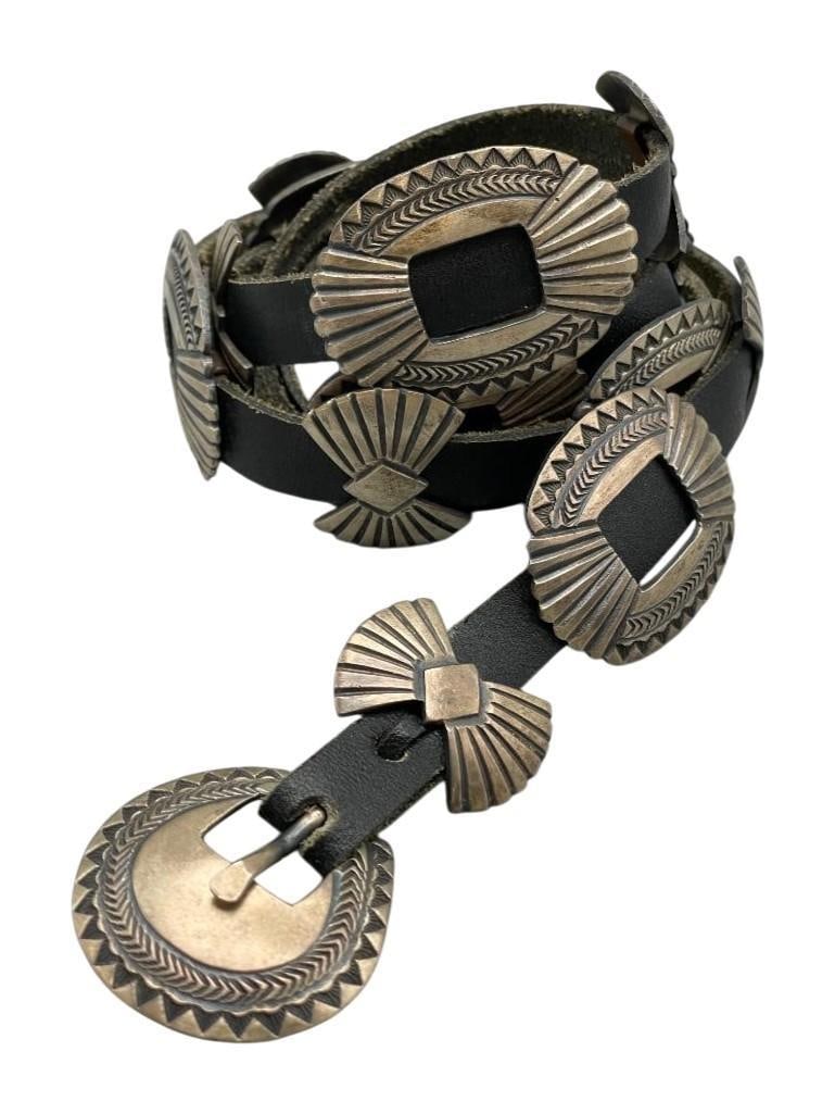 Small Size Sterling Silver Concho Belt: Offered here for your consideration is a small size sterling silver concho belt. The belt features nine butterfly conchos, eight round conchos and a buckle with each piece highlighted with great hand 