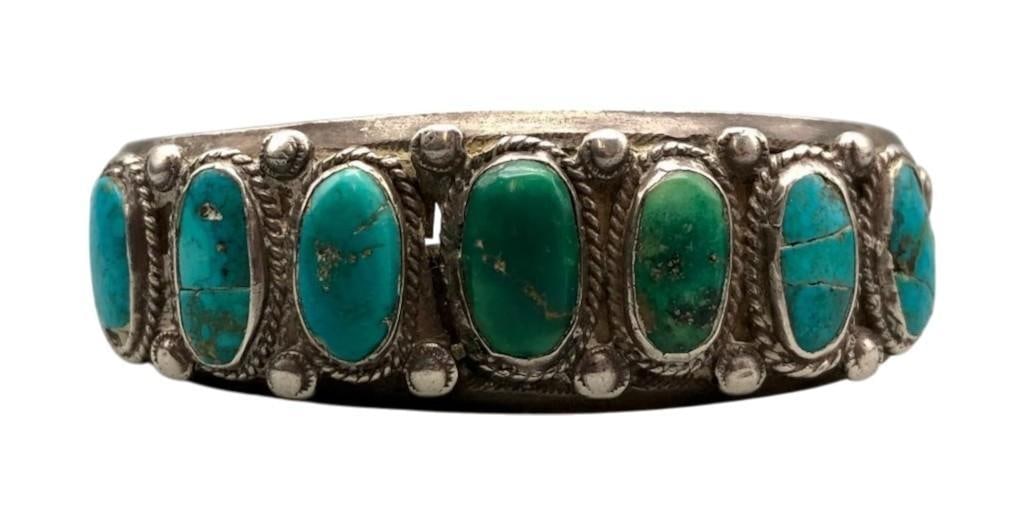 Circa 1920s Seven Stone Natural Turquoise Bracelet: For your bidding enjoyment we present a circa 1920s seven stone natural turquoise bracelet. This sterling silver bracelet features seven beautiful turquoise cabochons each displayed in smooth silver b