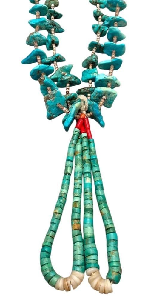 Vintage Turquoise And Heishi Necklace With Joclas: Offered here today is a vintage turquoise and Heishi necklace with Joclas. This striking necklace features numerous turquoise nugget style beads accented with shell Heishi beads in between. At the bot