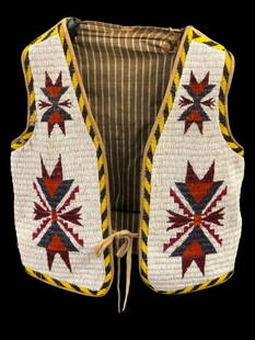 Early 1900s Sioux Beaded Vest With Hanging Display: Offered here for your consideration is a early 1900s Sioux beaded vest with hanging display. Lined with trade cloth on the inside, the supple leather vest is simply covered in the front with beautiful