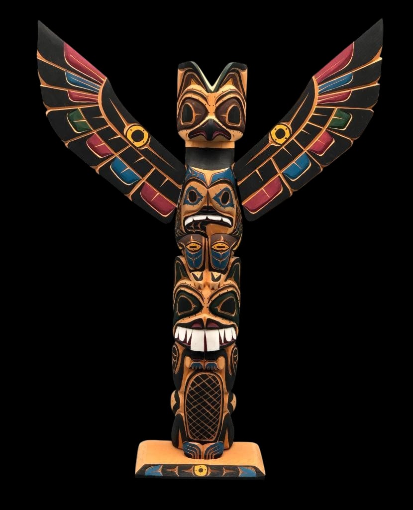 Northwest Coast Hand Carved Totem By Harvey And Josie Williams: Offered here for your consideration is a Northwest Coast handcarved totem by Harvey and Josie Williams. This totem features an intricately carved beaver and is topped with an owl with outspread wings.