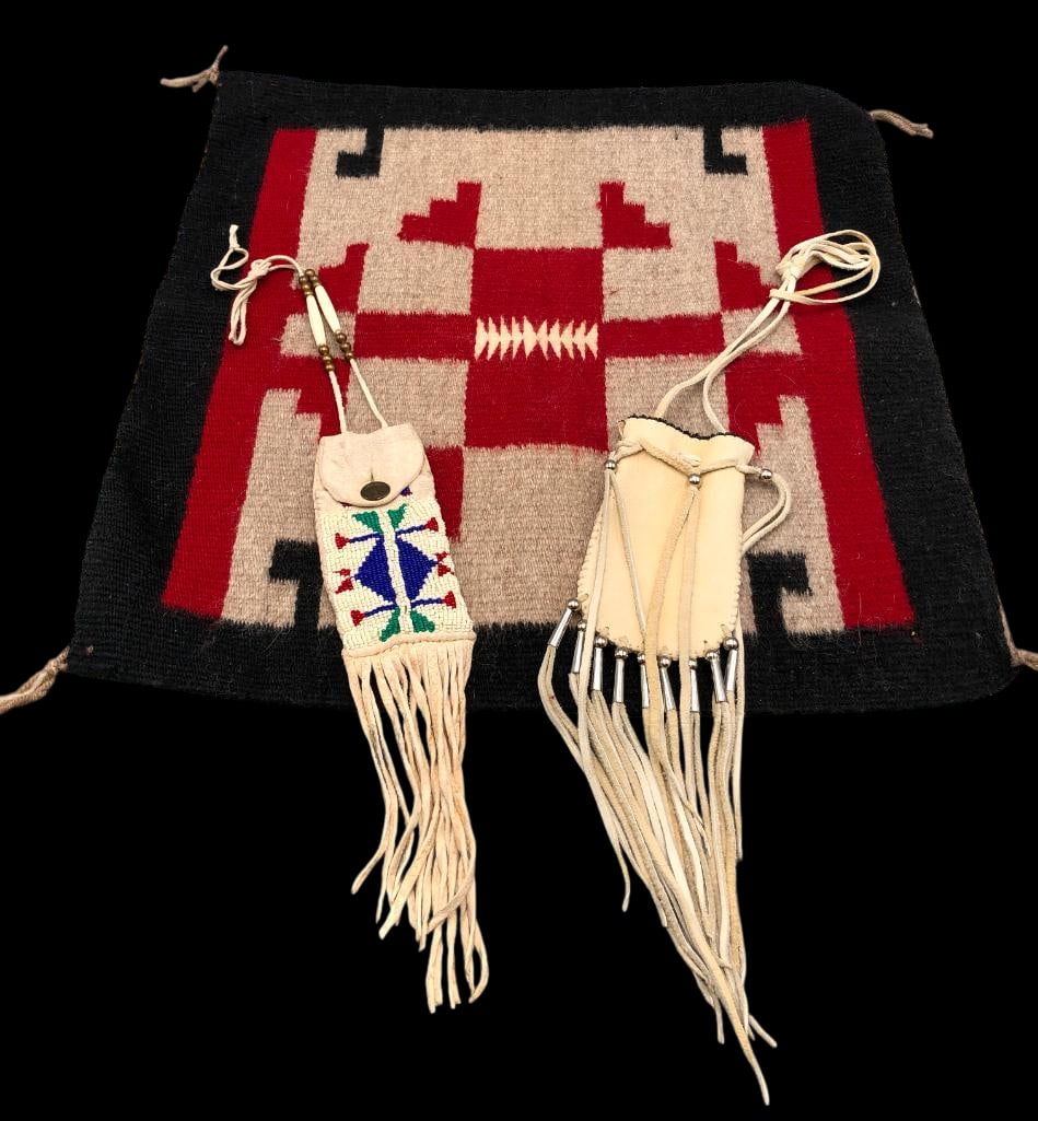 Two Handmade Leather Pouches And A Navajo Textile: Offered here for your consideration are two handmade leather pouches and a Navajo textile. The first leather pouch is made of very soft supple leather with brown bead on the opening edge. It has long 