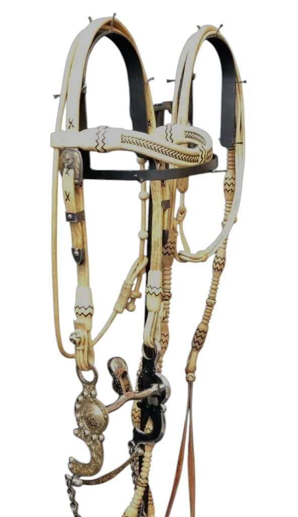 Wonderful Rawhide Bridle With Romal Reins And Jeremiah Watt Bit: Offered here for your consideration is a wonderful rawhide bridle with romal reins and Jeremiah Watt bit. This bridle is contemporary and although we found no makers mark, it is very well woven. The b