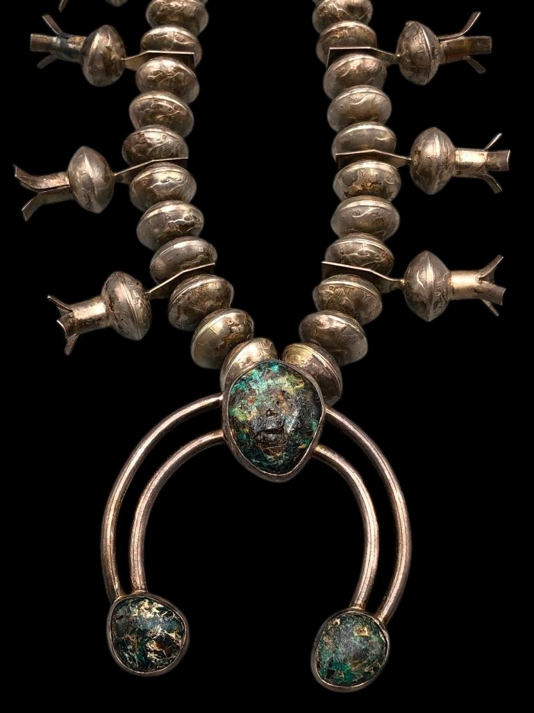 Hefty Four Petal Dime Bead Squash Blossom Necklace: Offered here for your consideration is a hefty four petal dime bead squash blossom necklace. This beautiful necklace features a conjoined two wire naja highlighted with three blue cabochons resting in