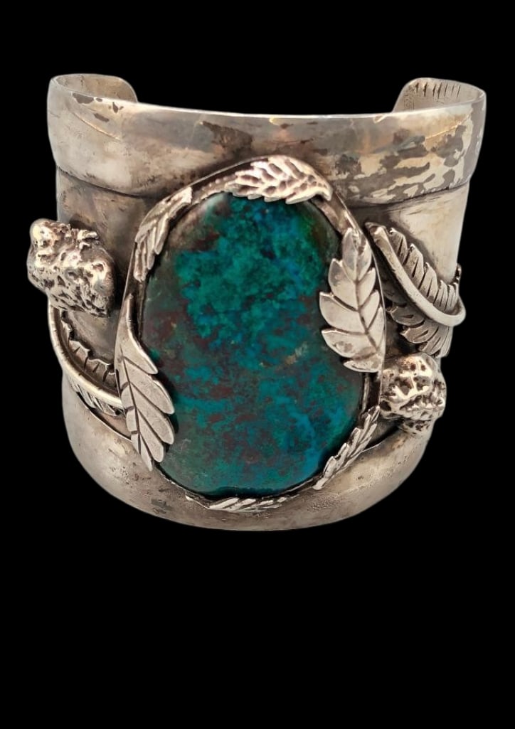 Unique Sterling Silver Bracelet With Chrysocolla Stone: For your bidding enjoyment we present a unique sterling silver bracelet with a chrysocolla cabochon. This bracelet features a central chrysocolla cabochon resting in a smooth silver bezel surrounded b
