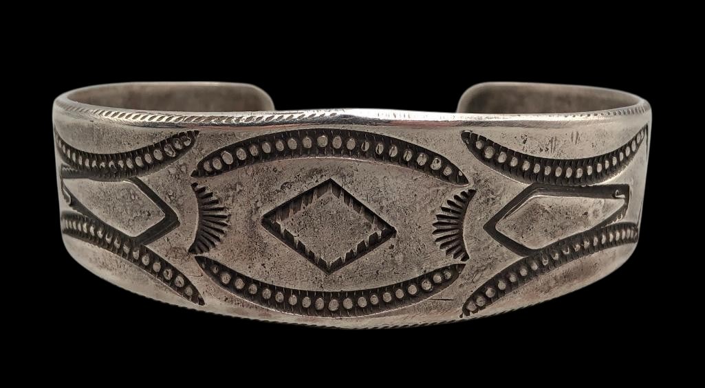 Ingot Stamped And Filed Cuff Bracelet: For your bidding enjoyment we present an ingot stamped and filed cuff bracelet. This bracelet features a beautifully crafted ingot sterling silver cuff highlighted with hand stamped designs throughout
