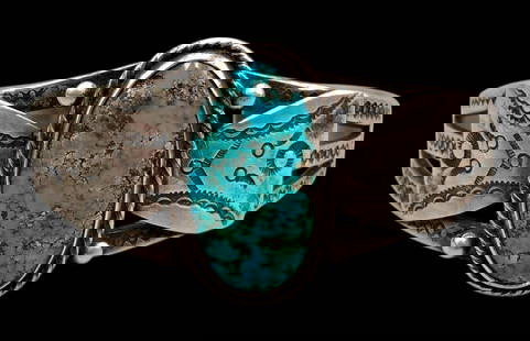 Vintage Ingot Turquoise Bracelet: For your bidding enjoyment we present a vintage ingot turquoise bracelet. This bracelet features a central turquoise cabochon resting in a smooth silver bezel surrounded by a twisted wire accent. The