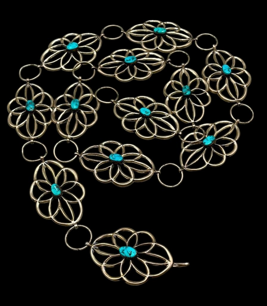 Sandcast And Turquoise Link Concho Belt: Offered here for your consideration is a sandcast and turquoise link concho belt. This belt features 11 conchos and a matching buckle each highlighted with a central turquoise cabochon resting in a sa