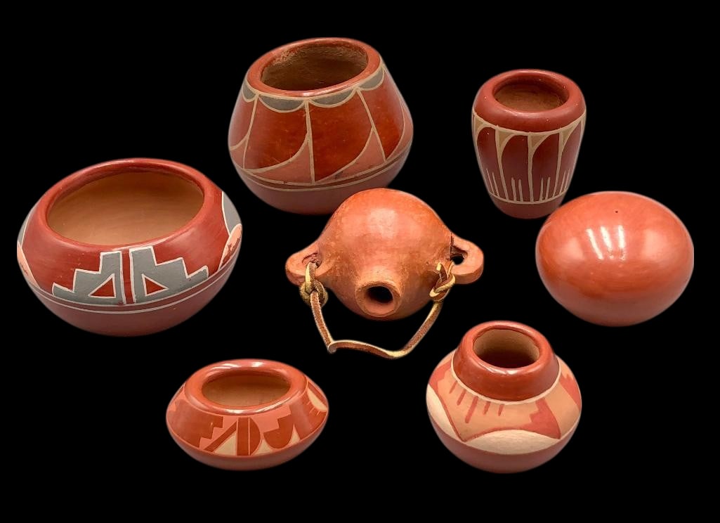 Group Of Seven Pueblo Pots: Presented here for your consideration is a group of seven Pueblo pots. This are six redware pots and a flat back canteen. Some are plain with no design and some have geometric designs. The canteen is