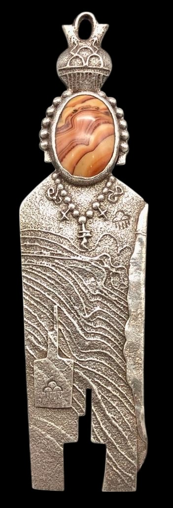 Nice Anthony Lovato Tufa Cast Pendant: Offered here is a nice Anthony Lovato tufa cast pendant. This pendant features a figural design highlighted with a dolomite cabochon resting in a smooth silver bezel. Accenting the design are silver d