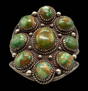 Green Turquoise Cluster Bracelet: Presented here for your bidding pleasure is a green turquoise cluster bracelet. This lovely bracelet features a cluster of nine turquoise cabochons resting in sawtooth silver bezels. Accenting the set
