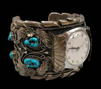 Hefty Vintage Turquoise Watch Bracelet: For your bidding enjoyment we present a hefty vintage turquoise watch bracelet. This sterling silver watch cuff features eight nugget style turquoise cabochons resting in sawtooth silver bezels. The s