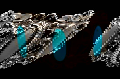 Turquoise And Sterling Silver Bracelet: Offered in this lot is a turquoise and sterling silver bracelet. This bracelet is highlighted with three turquoise cabochons resting in smooth silver bezels. *NOTE: One stone has a crack or fissure. S