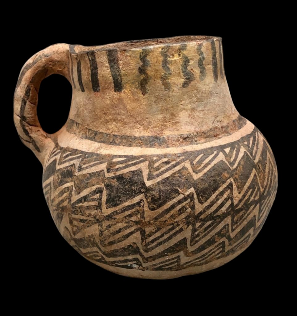 Tularosa Black on White Pottery Mug: Offered here for your consideration is a Tularosa black on white pottery mug with zig?zag designs and wave motifs. Tularosa pottery was produced by the ancestral Pueblo, the Anasazi, beginning about 1