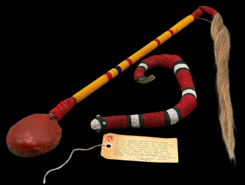 Plains Beaded Snake Charm And Club Circa Early 1900s - 1950s: Offered here for your consideration is an old beaded snake charm and beaded club, likely from the early 1900s to 1950s. The snake is fully wrapped and strung with red, black and white glass seed beads