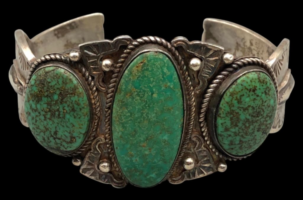 Three Stone Turquoise Bracelet by Sheila Tso: For your consideration is a three stone turquoise bracelet by Sheila Tso. This bracelet features three green turquoise cabochons displayed in smooth silver bezels framed with twisted wire, hand stampe