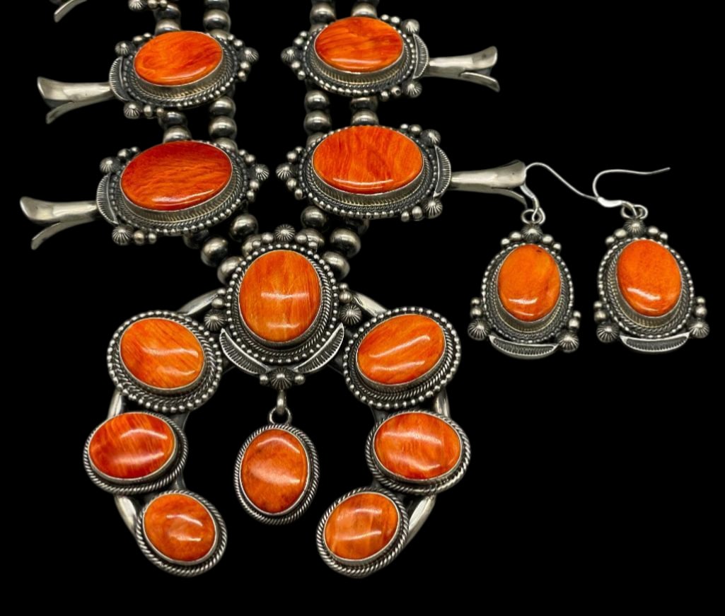 Spiny Oyster Squash Blossom Necklace with Earrings by Tom Lewis: For your bidding enjoyment we present a spiny oyster and sterling silver squash blossom necklace with matching earrings. Ten blossoms of graduated sizes and a beautiful naja are each highlighted with 