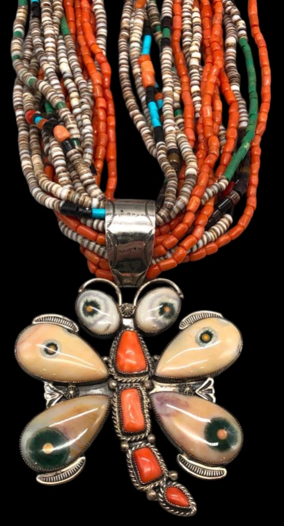 Dragonfly Necklace by Sheila Tso: Offered here for your consideration is a dragonfly necklace by Sheila Tso. This 16 strand necklace features beads of turquoise, coral, Heishi and others. The beads are all strung on waxed cord with si