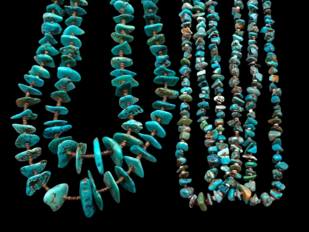 Two Turquoise and Heishi Necklaces: Offered here for your consideration are two turquoise and Heishi necklaces displaying turquoise nugget beads spaced with shell Heishi. One is strung on coated wire finished with silver tips and findin
