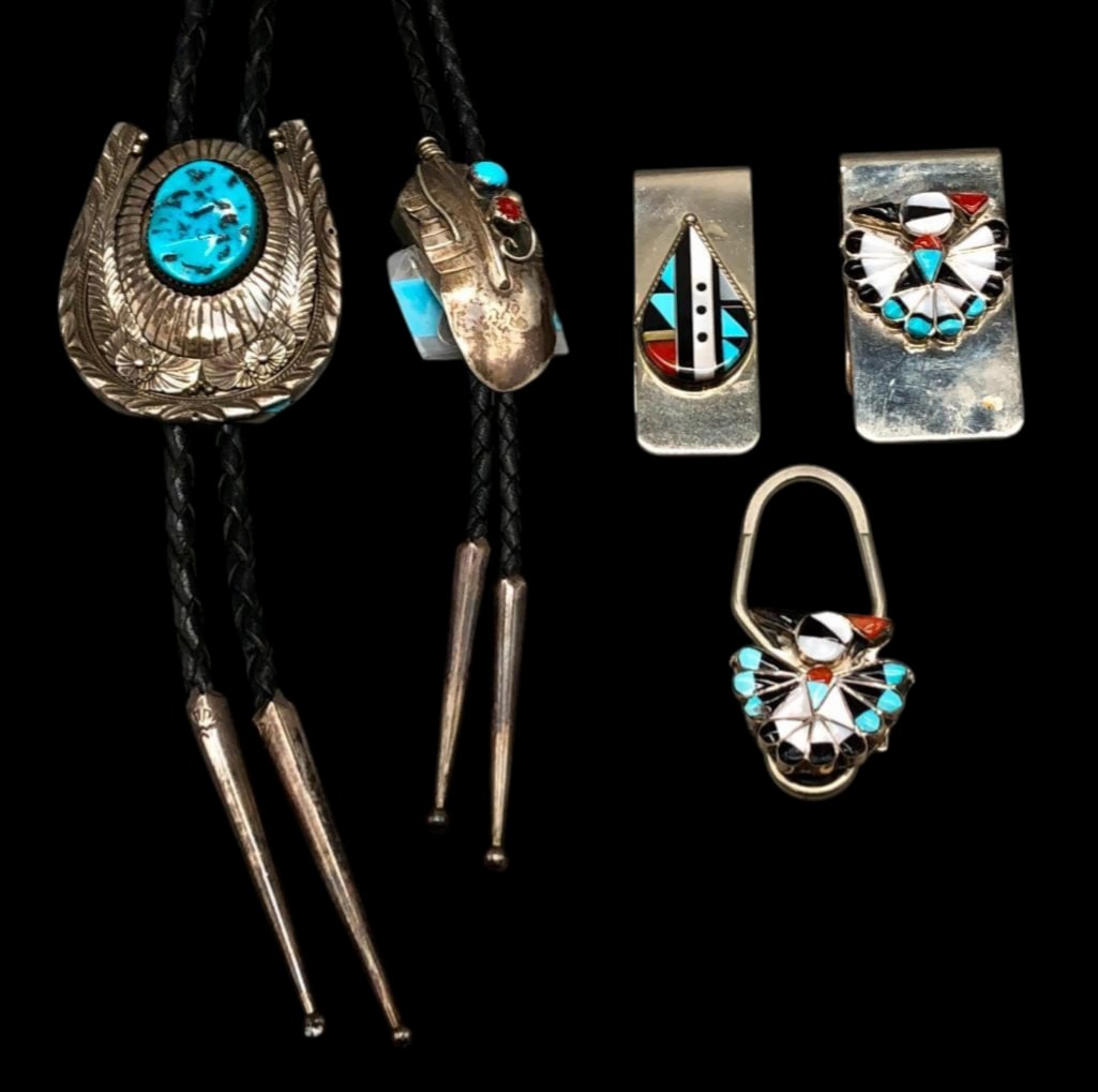 Two Bolo Ties, Two Money Clips and A Key Holder: Offered here for your consideration are two bolo ties, two money clips and a key holder. These pieces showcase a variety of designs including a horseshoe motif accented with a turquoise cabochon and a