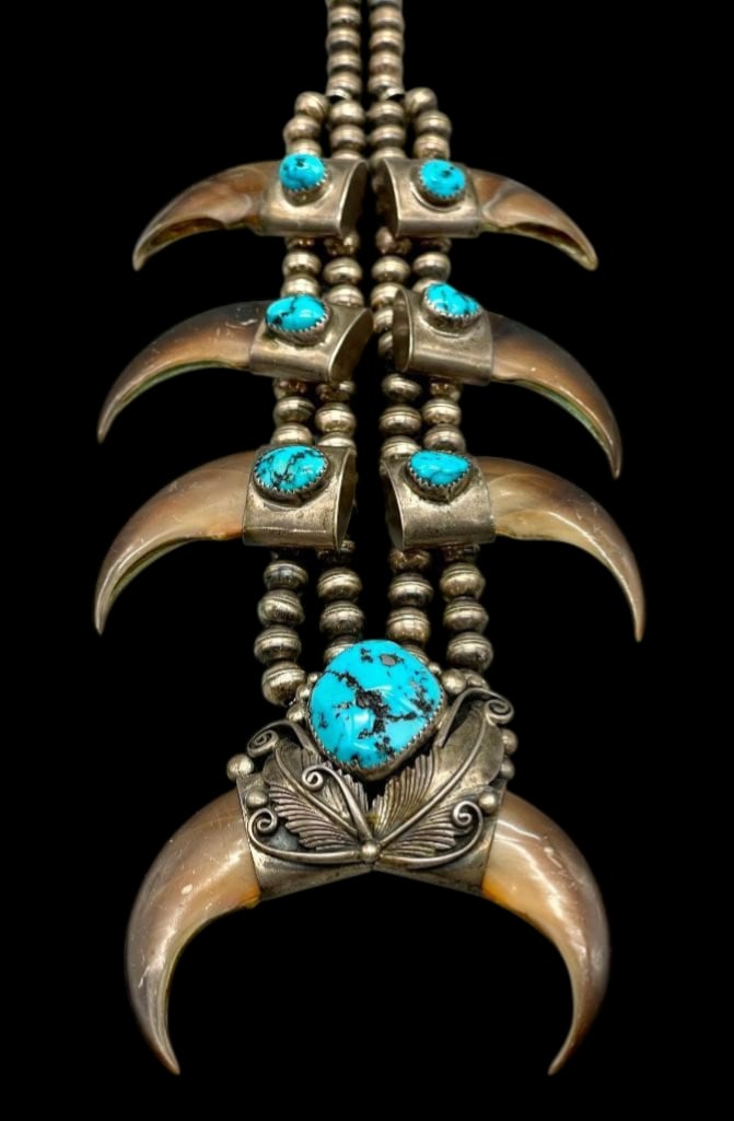 Vintage Turquoise Sterling Silver & Claw Necklace: Available here for your consideration is a vintage turquoise sterling silver and claw necklace. This necklace features a larger central pendant highlighted with two claws resting in smooth silver caps