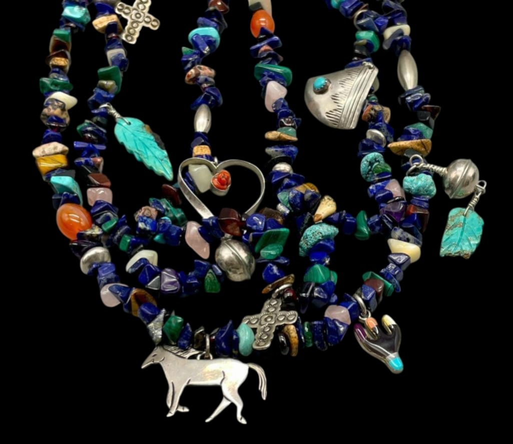 Multi Strand Treasure Necklace: Offered here for your consideration is a multi strand treasure necklace. This necklace features three strands of beads highlighted with turquoise, lapis, malachite and others all strung on waxed cord.