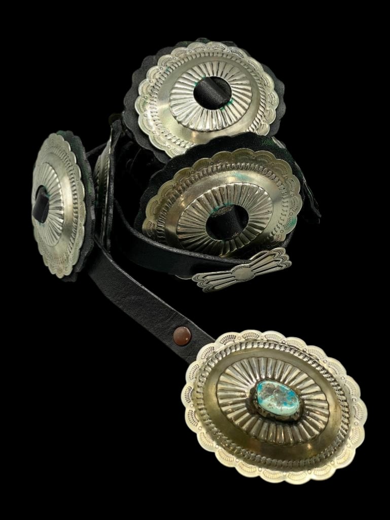 Nickel Silver Navajo Concho Belt: Offered here for your consideration is a nickel silver Navajo concho belt. This belt features five oval conchos, four butterfly conchos and a buckle all with hand stamped designs and scalloped edges.