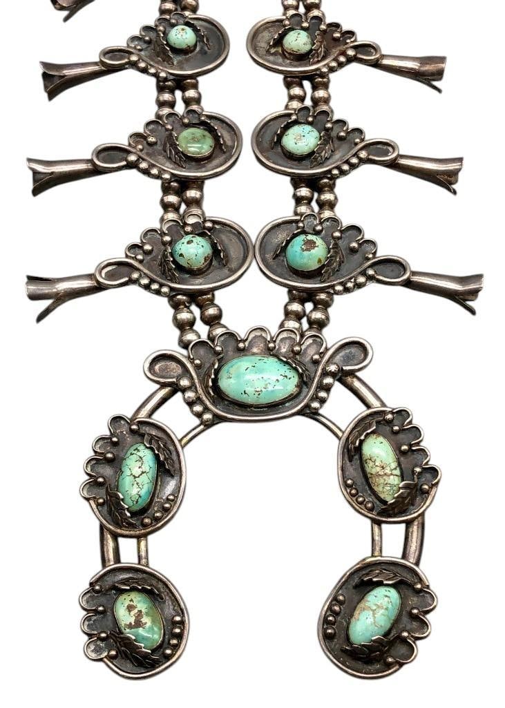 Vintage Green Turquoise Squash Blossom Necklace: Offered here for your consideration is a vintage green turquoise squash blossom necklace. This piece features green turquoise cabochons resting in smooth bezels accented with silver dots, arches and d