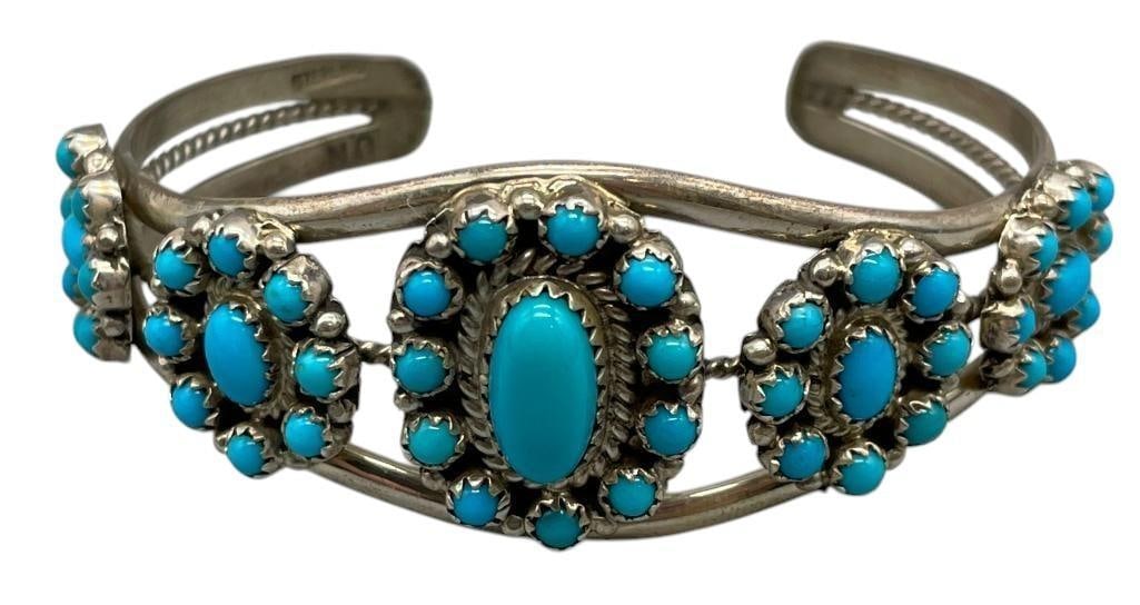 Sleeping Beauty Sterling Silver Cluster Bracelet: Offered here for your consideration is a Sleeping Beauty turquoise and sterling silver cluster bracelet. This bracelet features five clusters of Sleeping Beauty turquoise cabochons resting in sawtooth