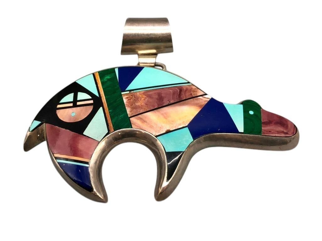 Multi Stone Inlay Bear Pendant: Offered here for your consideration is a multi stone inlay bear pendant by Frank Yellowhorse. This sterling silver bear pendant features an inlay of turquoise, lapis, spiny oyster, onyx, malachite and
