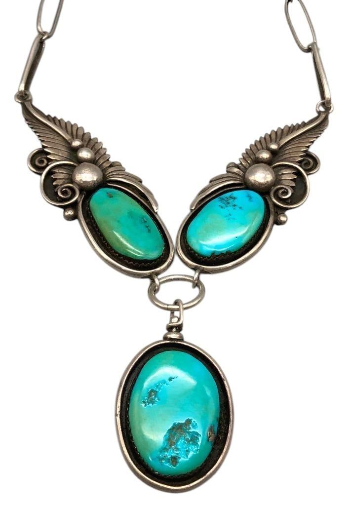 Vintage Turquoise And Coral Necklace With Double Sided Pendant: Offered here for your consideration is a vintage turquoise and coral necklace with double sided pendant. This necklace features two large turquoise cabochons set in smooth silver bezels, each accented