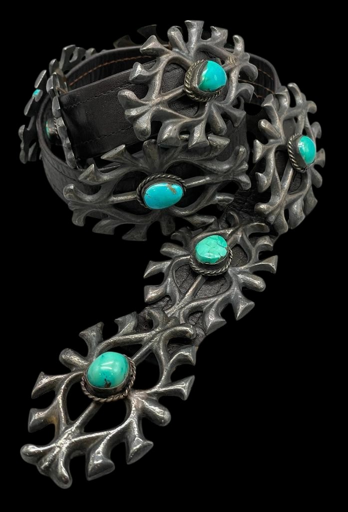 Vintage Sandcast And Turquoise Concho Belt: Offered here for your consideration is a vintage sandcast and turquoise concho belt. The sterling silver belt features eight sandcast silver conchos and a buckle. Each piece is highlighted with a cent