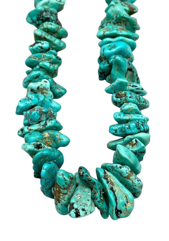 Vintage Chunky Turquoise Necklace: Offered here for your consideration is a vintage chunky turquoise necklace. This necklace features turquoise nugget beads in graduated sizes. The beads are strung on coated wire finished with silver b
