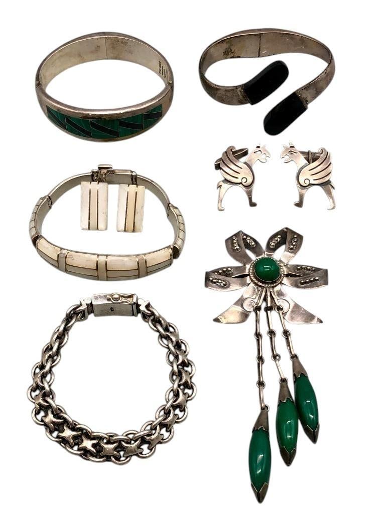 Group Of Taxco Sterling Silver Jewelry: Available here for your consideration is a group of Taxco sterling silver jewelry. This group includes four bracelets, one pin, a pair of earrings and a pair of cuff links with varying designs. The mo