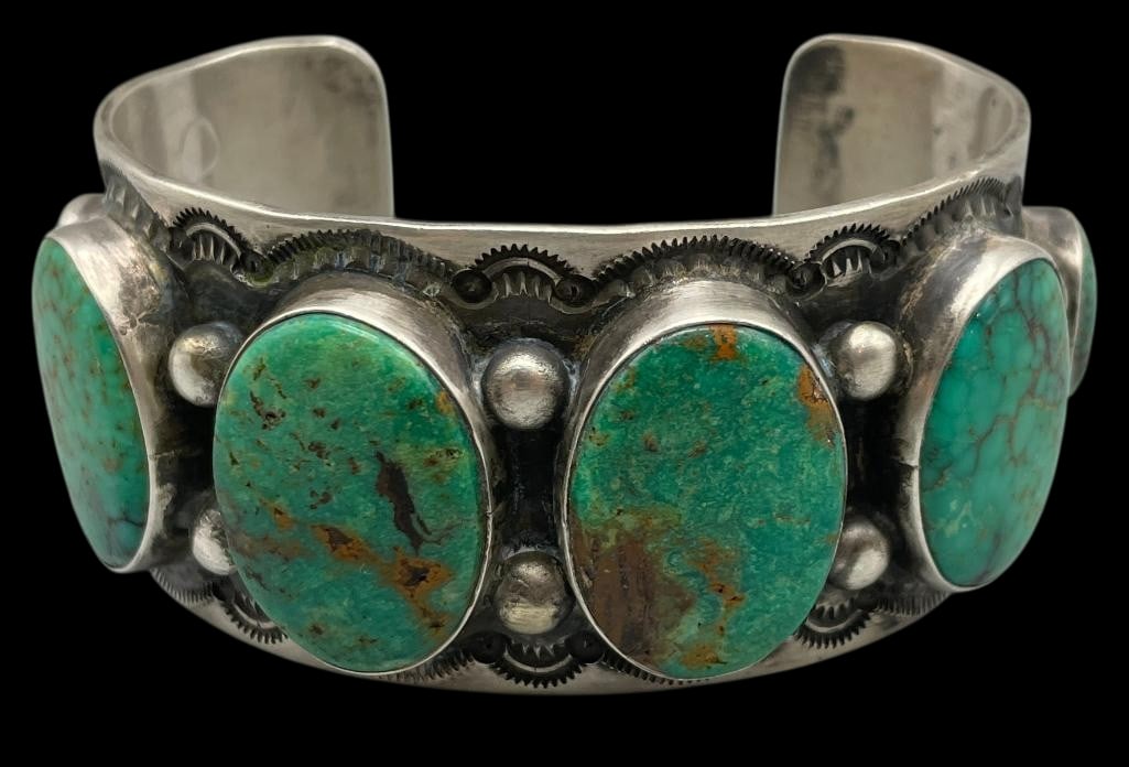 Vintage Herman Smith Six Stone Turquoise Bracelet: For your bidding enjoyment we present a vintage Herman Smith six stone turquoise bracelet. This bracelet features six turquoise cabochons set in smooth silver bezels. The settings are on a sterling si