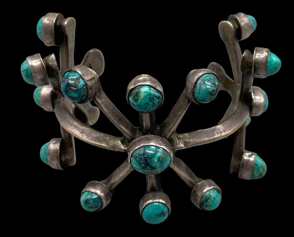 Unique Style Vintage Sandcast And Turquoise Bracelet: Offered here for your consideration is a unique style vintage sandcast and turquoise bracelet. This bracelet features a sandcast sterling silver design highlighted with 17 turquoise cabochons set in a
