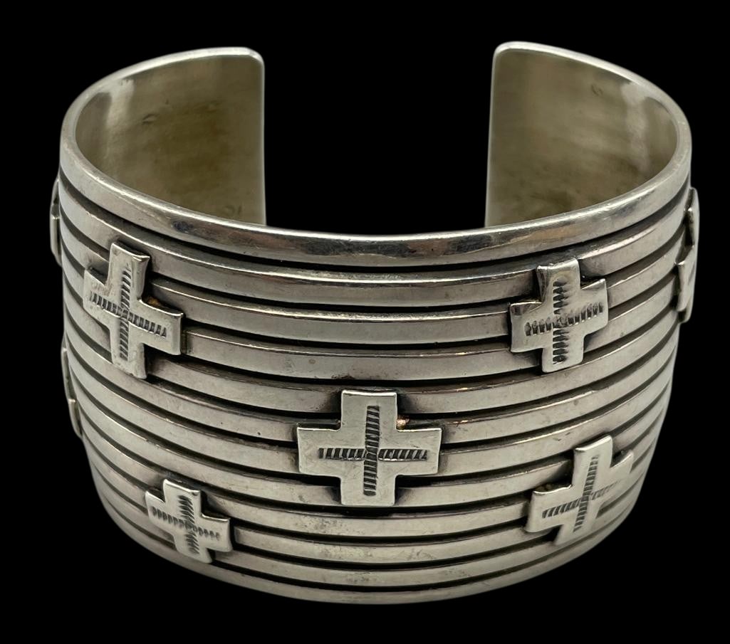 Cross Themed Sterling Silver Bracelet by Andy Cadman: For your bidding enjoyment we present a cross themed sterling silver bracelet by award winning designer, Andy Cadman. This cuff bracelet features raised silver crosses accented with hand stamped patte