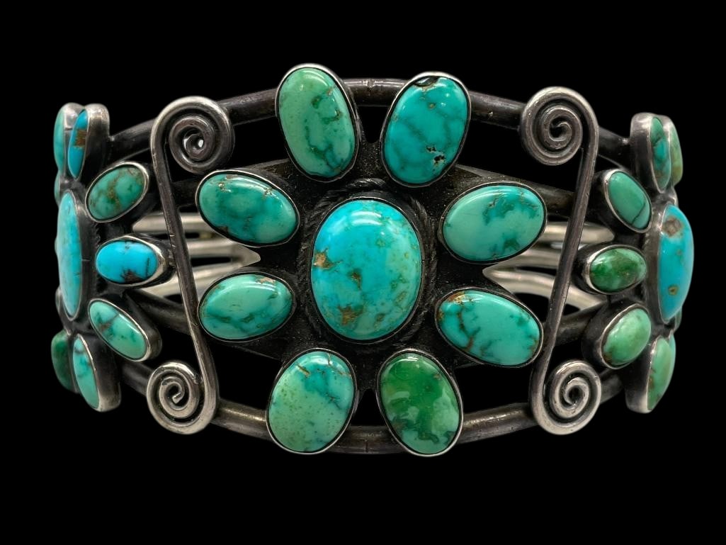 Circa 1920s Pueblo Natural Turquoise Cluster Bracelet: For your bidding enjoyment we present a circa 1920s Pueblo natural turquoise cluster bracelet. This sterling silver bracelet features three settings highlighted with eight natural turquoise cabochons 
