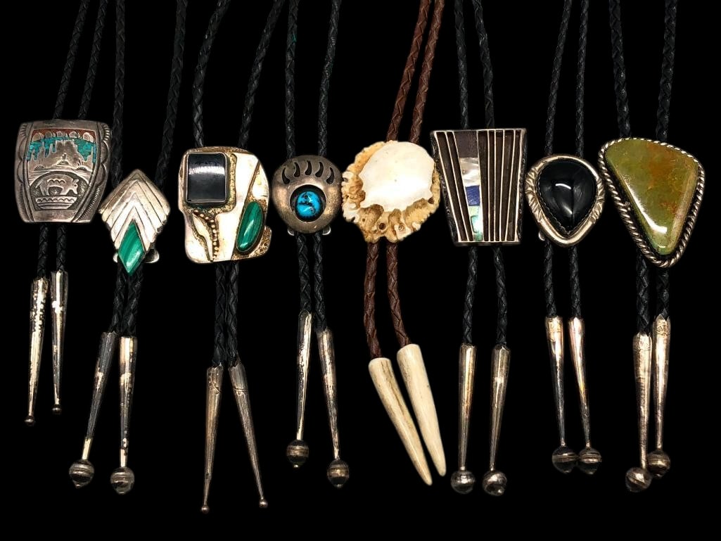Group Of Eight Bolo Ties: Offered here for your consideration is a group of eight bolo ties. This group includes a variety of designs, some featuring turquoise, malachite, onyx, shell, antler and inlay. Accenting the settings