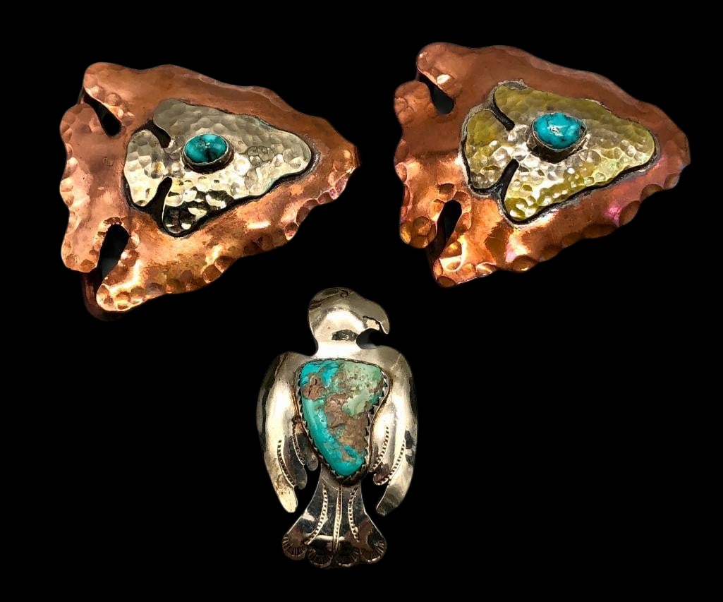 Two Vintage Arrow Themed Buckles And Thunderbird Pendant: Offered here for your consideration are two vintage arrow themed buckles and a Thunderbird pendant. The copper and brass arrow motif buckles are accented with turquoise cabochons set in smooth silver