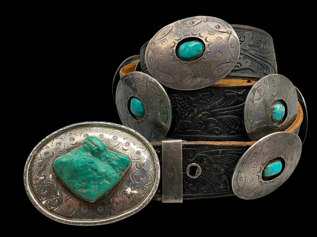 Vintage Turquoise And Sterling Silver Concho Belt: Offered here for your consideration is a vintage turquoise and sterling silver concho belt. The belt has nine oval conchos with a single turquoise cabochon resting in a shadowbox style setting surroun