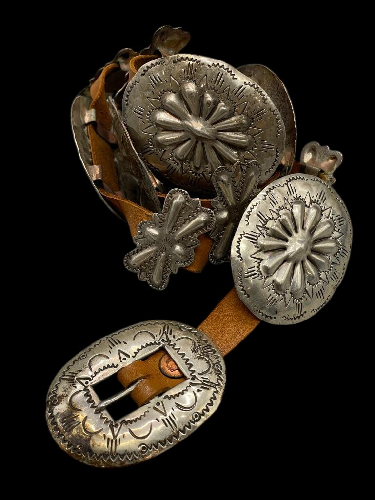 Vintage Sterling Silver Concho Belt: Offered here for your consideration is a vintage sterling silver concho belt. The belt has oval conchos alternating with butterfly conchos, all with repousse work and stamped designs. The buckle featu