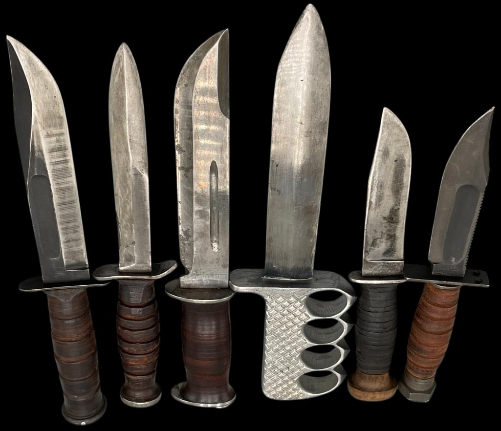 Six WWII Era Fighting Knives: Offered here for your consideration is a group of six WWII era fighting knives. The group includes examples with stacked leather handles, aluminum pommels and one with an integral knuckle guard. Sever