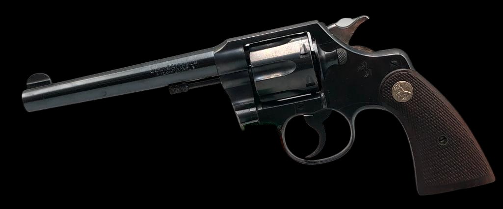 Colt Official Police .38 Caliber Double Action Revolver: Offered here for your consideration is a Colt Official Police .38 caliber double action revolver. This example features a blued finish, checkered wood grips with Colt medallions, fixed sights, and is
